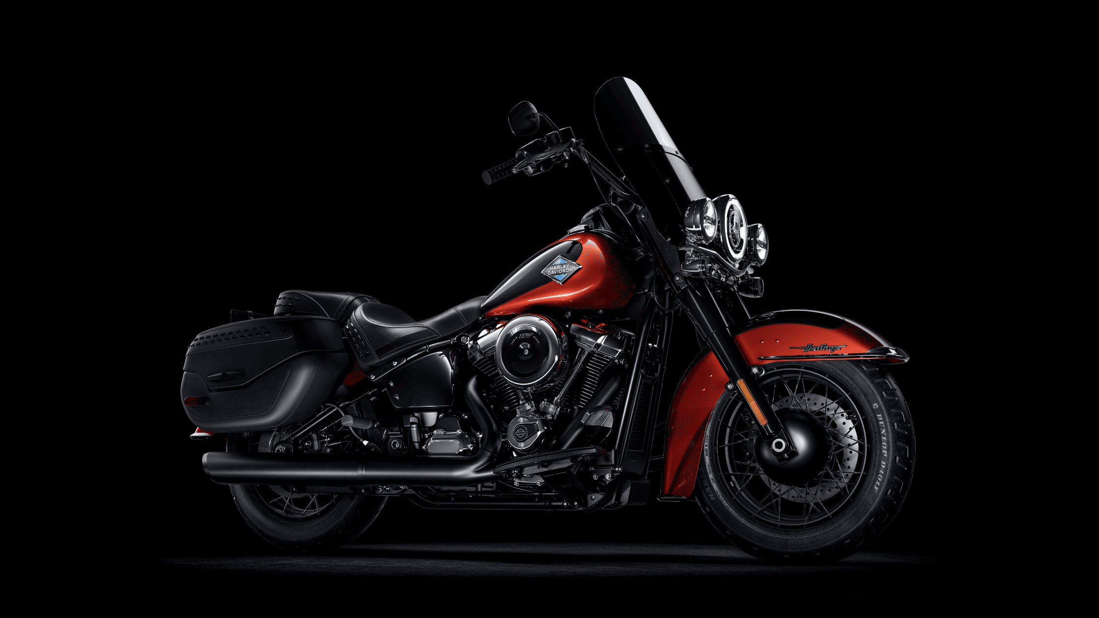 2025 Harley-Davidson® Heritage Classic in a bold red and black finish, showcasing its vintage-inspired design, detachable windshield, and smooth Milwaukee-Eight power. Available in Lincoln, NE.